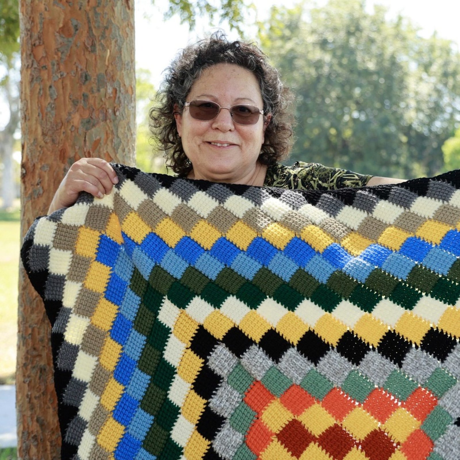 An image of a person formerly sentenced to LWOP holding up a blanket.